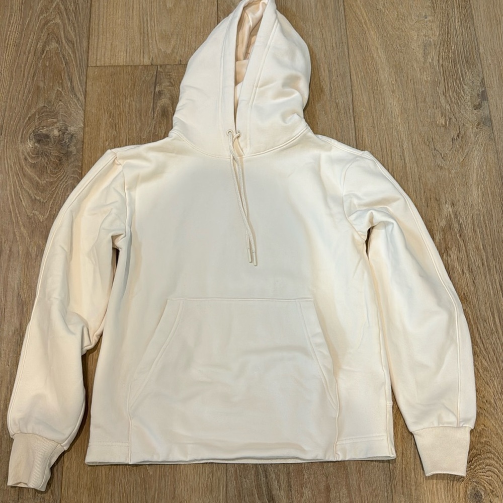 Athleta hooded sweat shirt ivory color. No tags but never worn. Very soft.